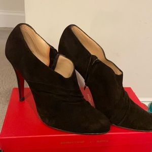Christian Louboutin‘s Brown booties